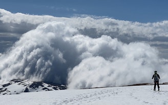 11 Alex Watt Skinning towards some beautiful cloud formations towards Cairn Toul.jpg